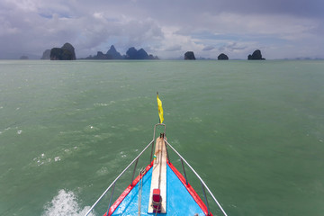 A traditional Thai boat on the way to the limestone islands and Phang Nga Bay