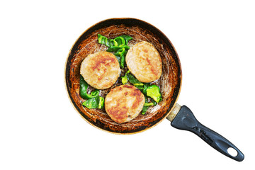 Meat cutlets fried with green pepper. Old cast-iron pan with Meat cutlets and green pepper isolated on white background