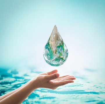 World ocean day,, saving water campaign, sustainable ecological ecosystems concept with green earth on woman's hands on blue sea background : Element of this image furnished by NASA .