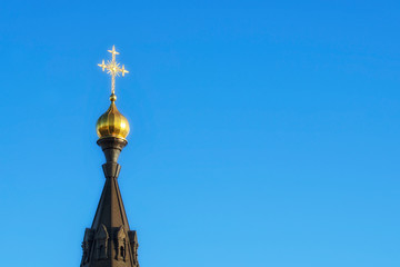 Dome of the Christian Orthodox Church lit by the bright sun.