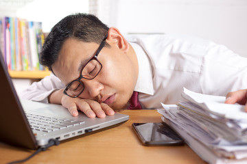 Tired Sleepy Asian Businessman Having Overworked
