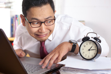 Asian Businessman Worried by Time, Work Deadline Stress