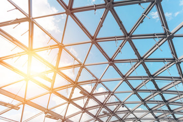 Fragment of latticed window with sky visible through