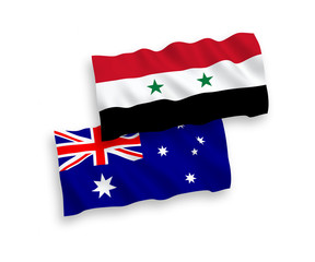 National vector fabric wave flags of Australia and Syria isolated on white background. 1 to 2 proportion.