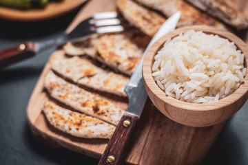 grilled chicken breast with cooked rice and vegetables, healthy food