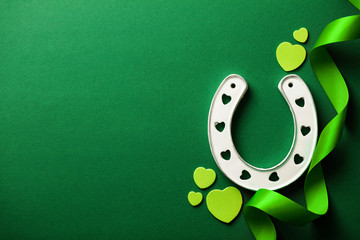 St Patrick's Day green background with lucky horseshoe