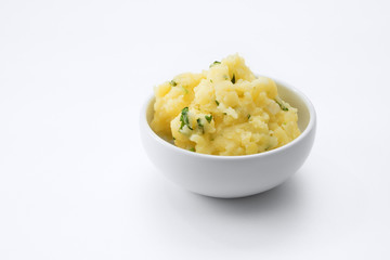 close up view of fresh mashed potatoes  on white background