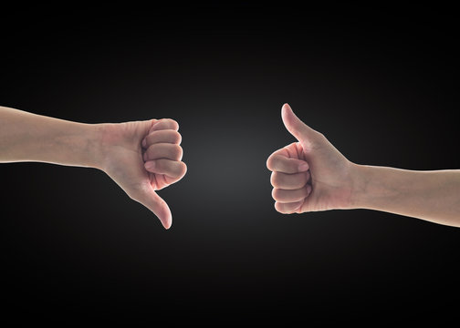 Like - unlike hand with thumb up - down symbolic people gesture isolated on black background with clipping path - Powered by Adobe