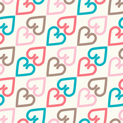 Bright seamless pattern with alternate colorful hearts.