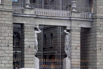 Image of a fragment of the facade of an apartment house with statues of Atlantes in St. Petersburg,...