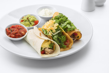 close up view of nice fresh yummy Mexican tacos on white back