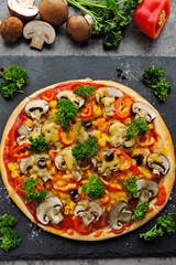 Vegan pizza with mushrooms, vegetables and herbs. Keto diet. Pegan diet.
