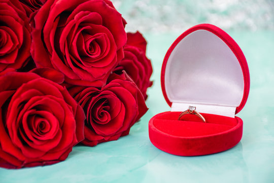 Red roses with boke background. box with a ring. copy space. 8 March Women s Mother Day