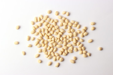  peeled peanuts on a white background top view.