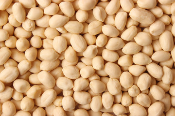 aw peeled peanuts background. close-up