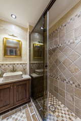 Contemporary bathroom with corner shower and decorative elements