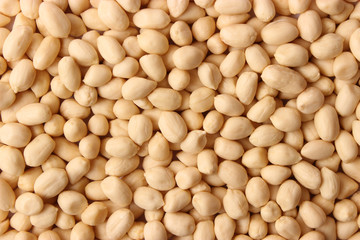 aw peeled peanuts background. close-up