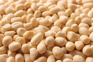 aw peeled peanuts background. close-up