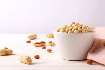 raw peeled peanuts on a light background