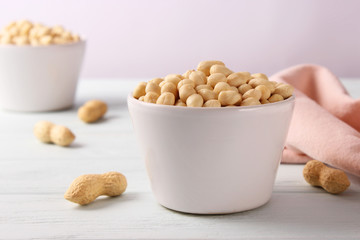 raw peeled peanuts on a light background