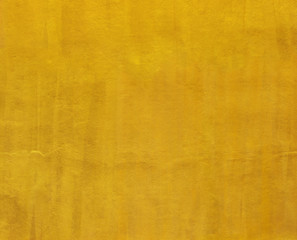 Gold paint cement wall background for design.