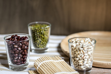 Cereals in glass cups placed on a wooden background
