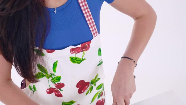 Portrait of girl who cutting vegetables on cutting board