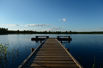 wooden jetty on the lake at early morning
