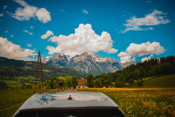 car in front of mountains and sky