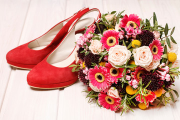 Wedding bouquet and a pair of stilettos.