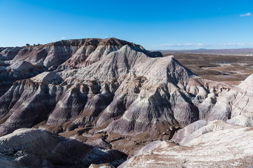 Rugged, barren, and heavily eroded desert mountain peaks in Petrified Forest National Park, Arizona