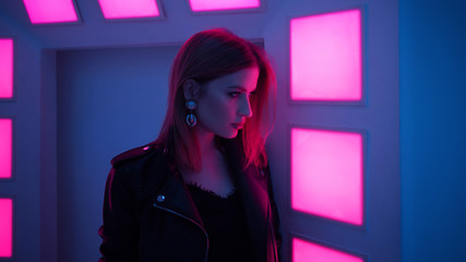 Beautiful girl in retro wave on the neon light