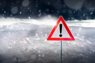 winter driving - warning sign - risk of snow and ice
