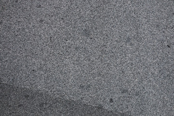 Gray granite texture. Subtle grain stone background. Dark rough granitic wall