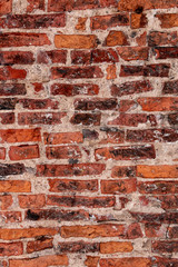 Naklejka premium Brick wall close-up photo. Vintage textured surface with old red brickwork