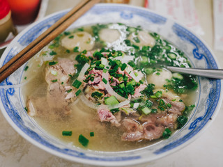 Traditional Vietnamese soup Pho Bo | Bowl of pho noodle with meat, beef,  scallions in Saigon, Vietnam