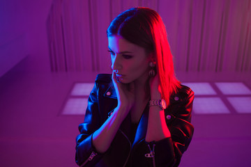 Beautiful girl in retro wave on the neon light