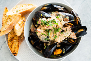 Mussels with herbs in a bowl