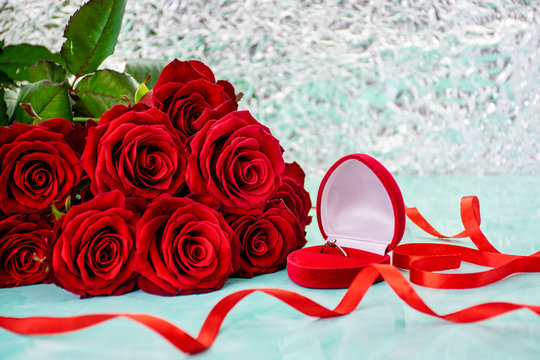 Red roses with boke background. box with a ring. red ribbon. copy space. 8 March Women s Mother Day