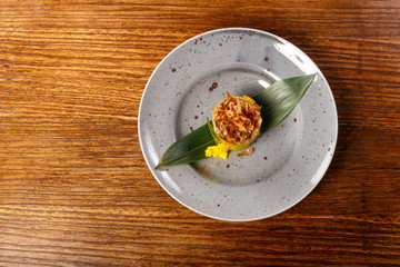 dish of  Ratotoue with leaf on back wood background 