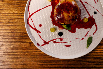 dish of fuagra decorated on black wood table background 