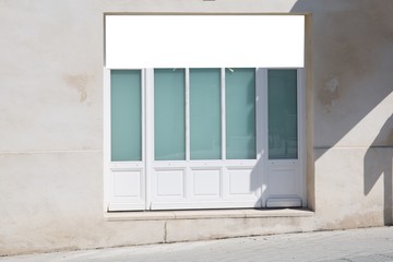 horizontal white empty blank signage on shop front with wood glass windows