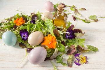 Obraz na płótnie Canvas Lettuce and flower salad on woody white background spring, easter