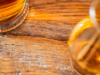 Irish Whiskey Glass and Whiskey Bottle on Reclamined Wood Soft Focus
