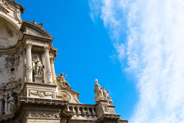 Fototapeta na wymiar Part of facade of catholic cathedral with columns and sky in Spain.Architecture of baroque and renaissance style.