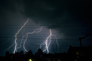 Branched lightning bolts over the city of Vlaardingen near Rotterdam, Netherlands