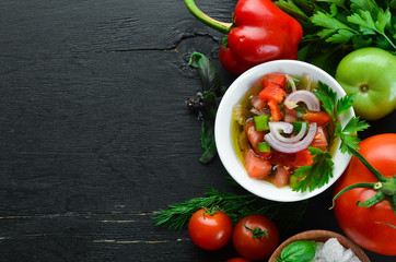 salsa sauce and ingredients. Latin American Mexican Traditional Sauce. Top view. On a black background. Free space for text.