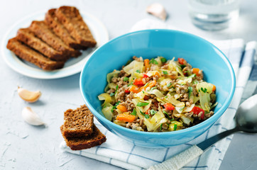 Cabbage minced beef ragu with fresh rye bread