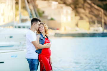 A Pregnant woman with husband on a journey. Boat pearce