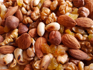 nuts background. Walnut, cashew, raisin, almond and hazelnut background texture